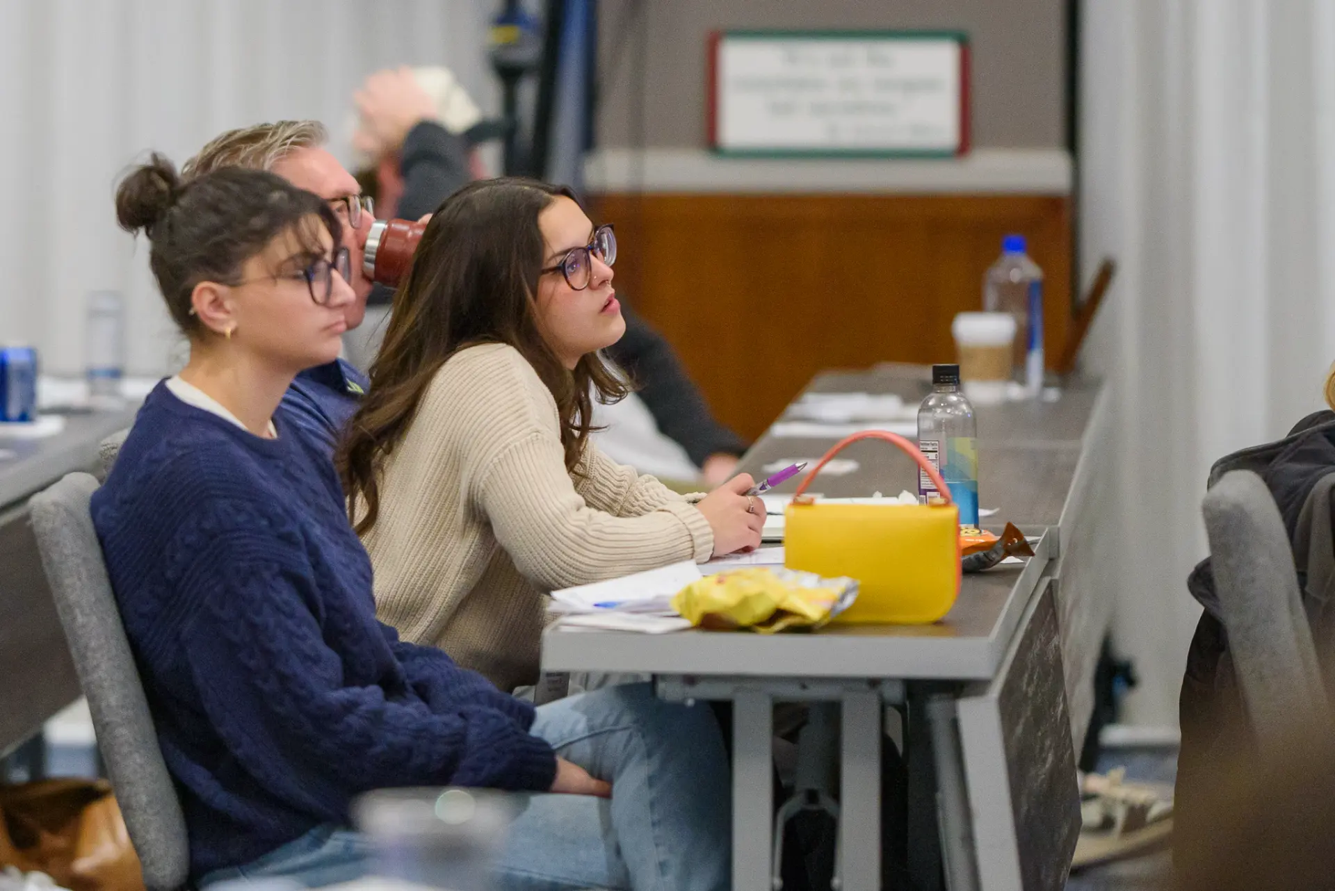 TLC members listening intently during a session