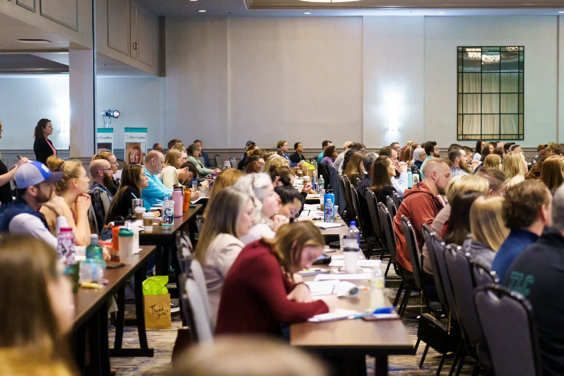 Chiropractors seated together during a TLC live seminar