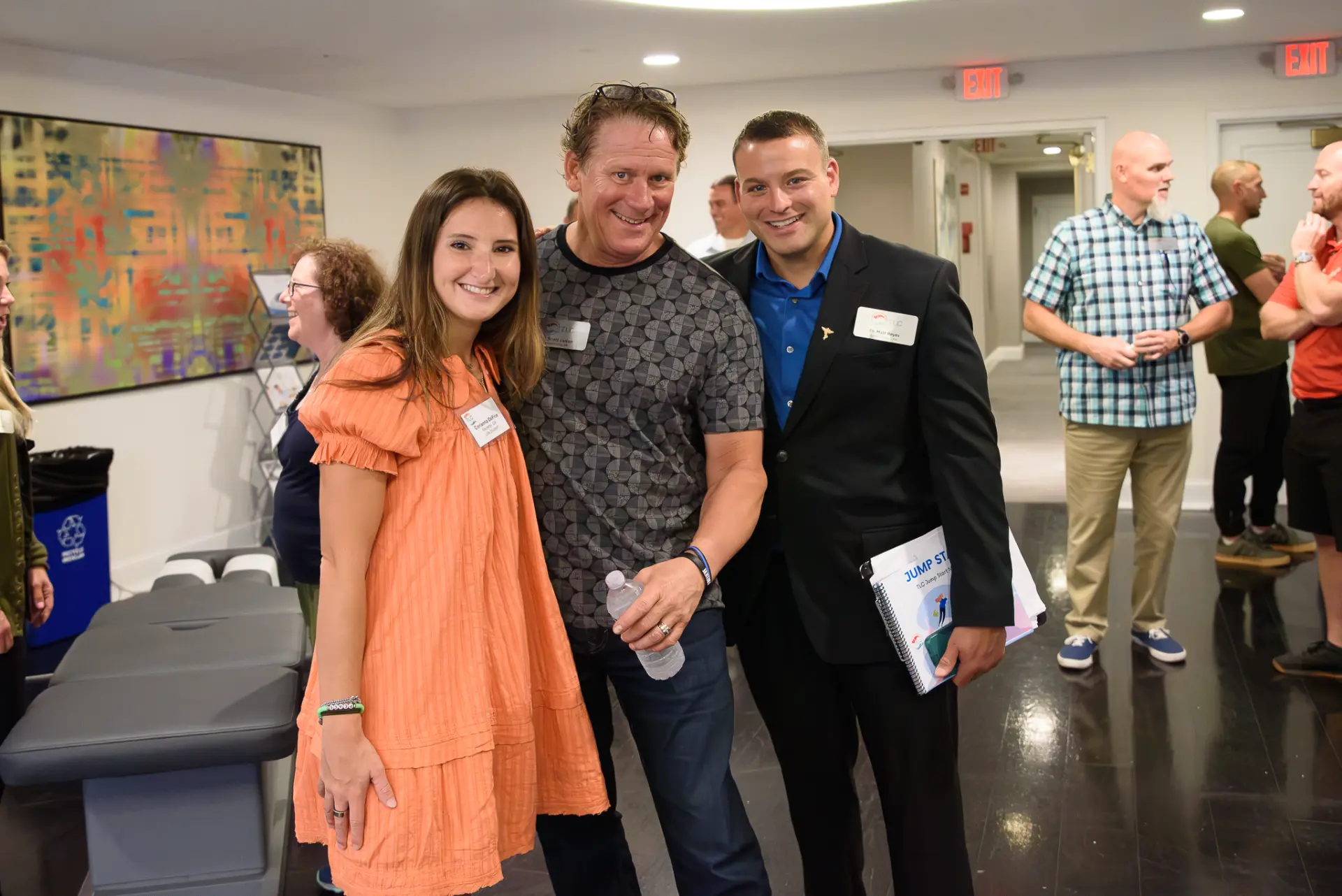 TLC members catching up in the lobby at an event