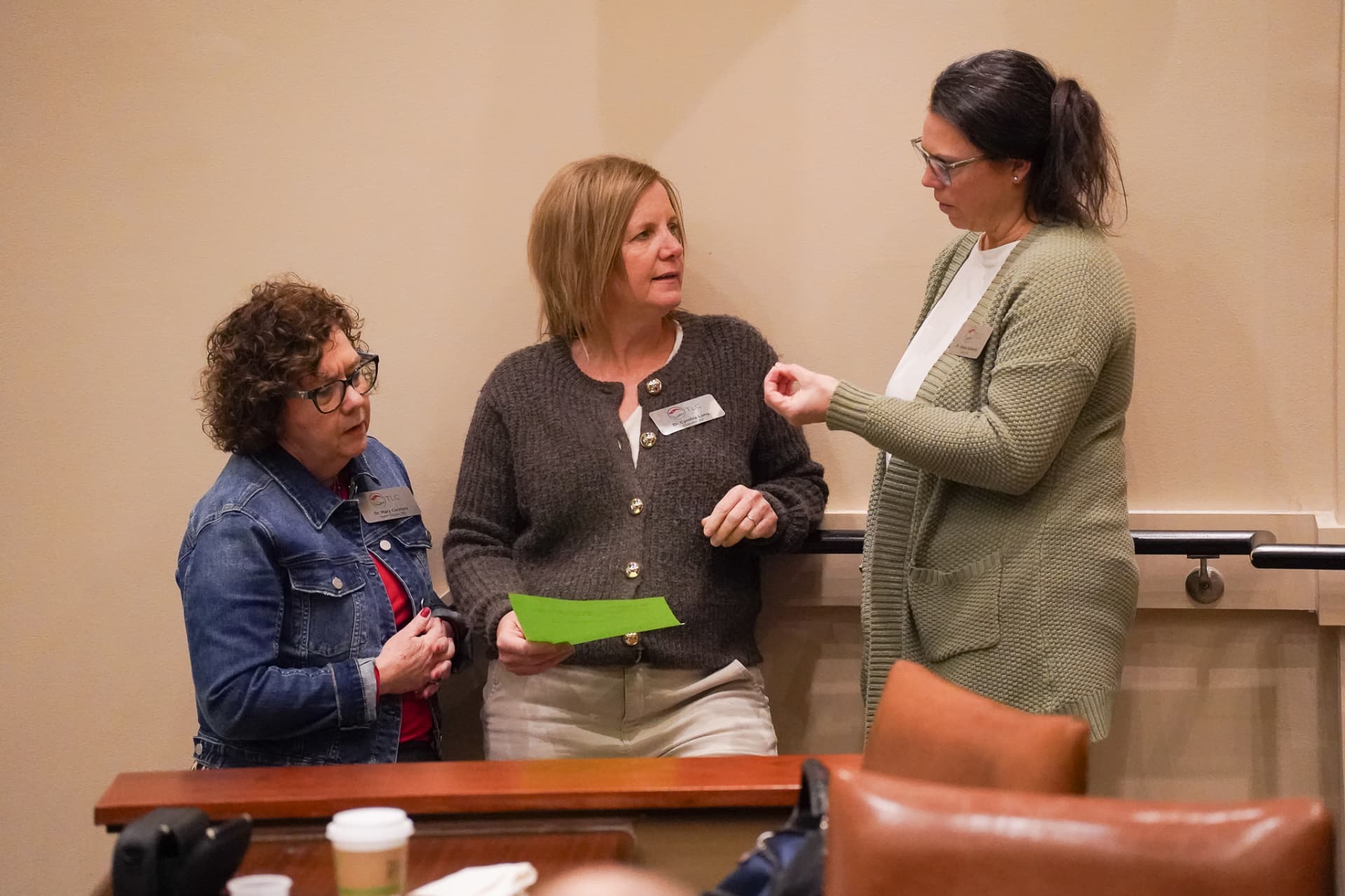TLC members in conversation during a seminar break