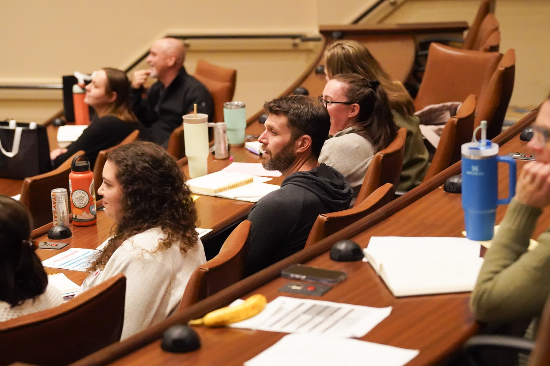 TLC members listening intently in seminar seating