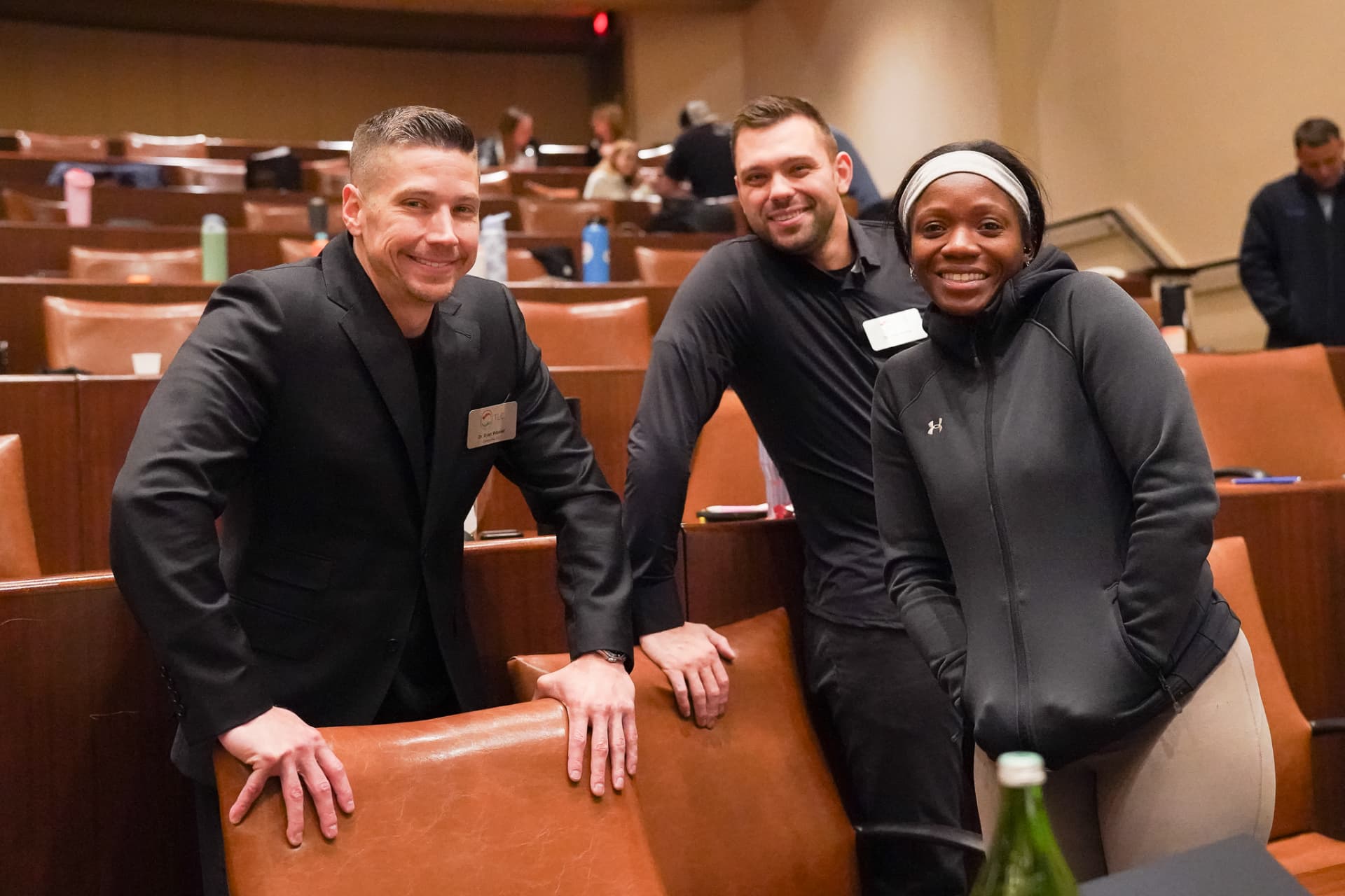 TLC members smiling together between seminar sessions