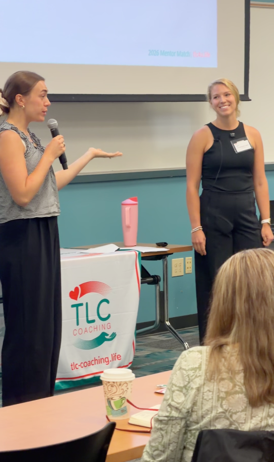 Two TLC coaches presenting to students at a TLC Mentor Match session