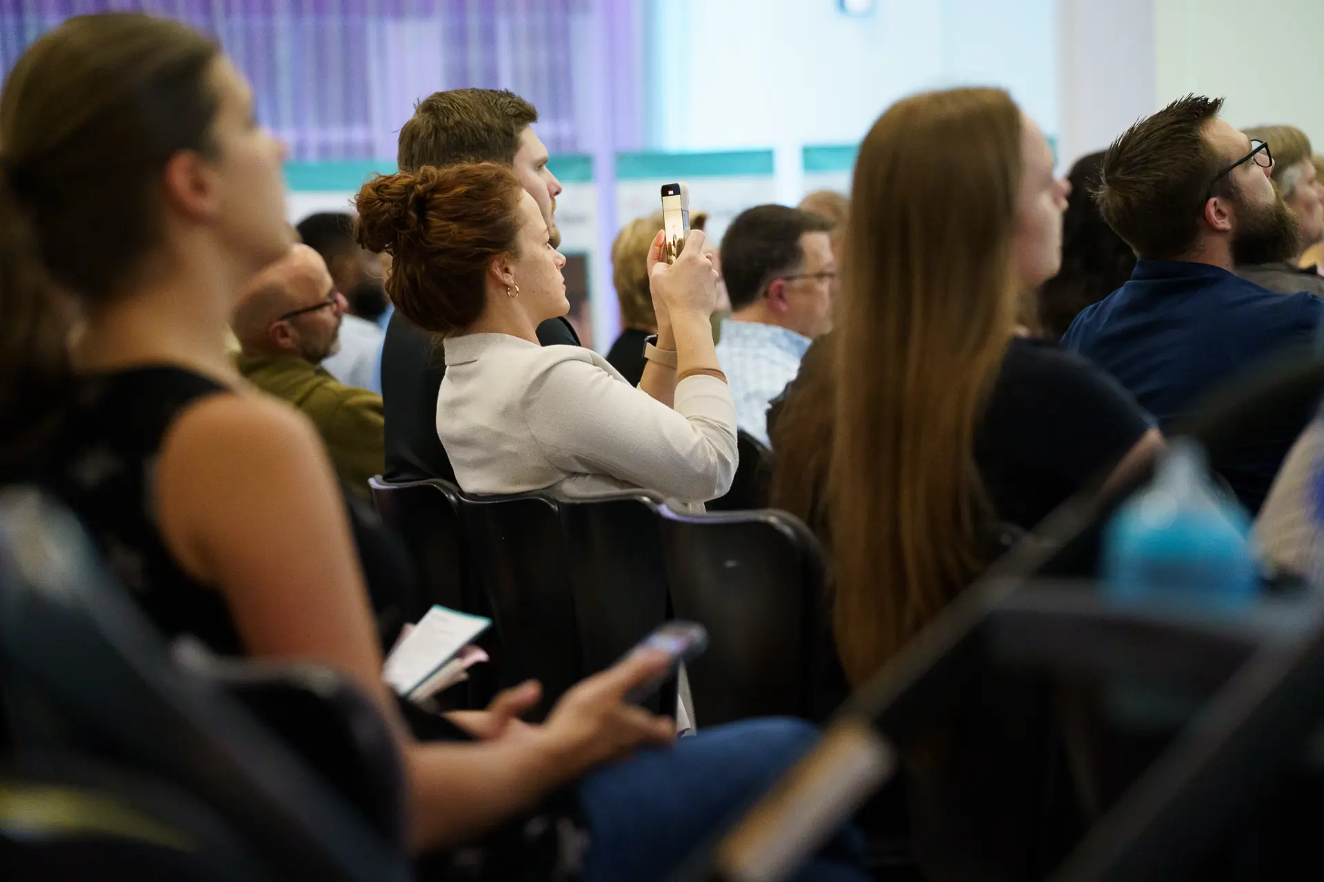 A TLC member photographing a slide during a session